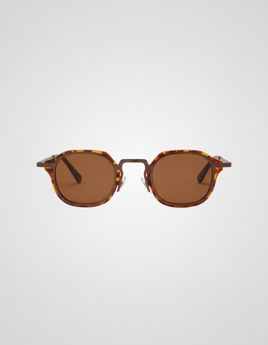 Sunglasses with tortoiseshell frame and brown lenses on a light gray background